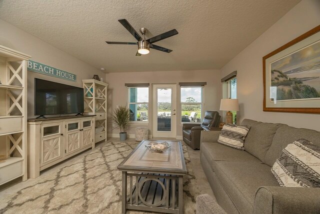 view of patio / terrace featuring a rural view and an outdoor living space with a fire pit