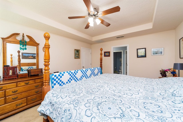 142 Patriot Ln, Elkton, FL 32033 - bedroom featuring carpet floors, a ceiling fan, and a raised ceiling