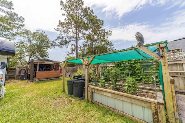 142 Patriot Ln, Elkton, FL 32033 - view of yard with a vegetable garden