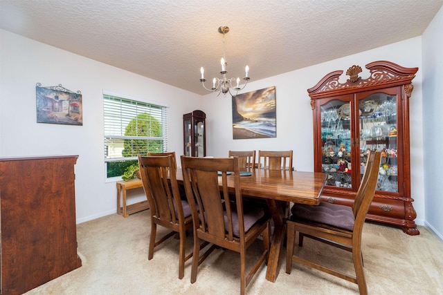 142 Patriot Ln, Elkton, FL 32033 - dining space with light colored carpet, a chandelier, a textured ceiling, and baseboards