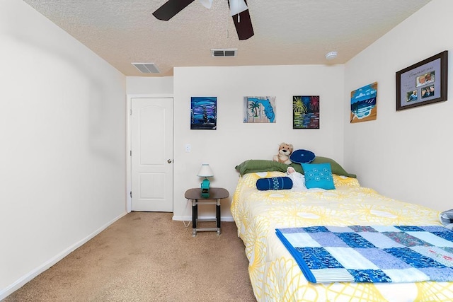 142 Patriot Ln, Elkton, FL 32033 - bedroom with carpet floors, baseboards, a textured ceiling, and a ceiling fan