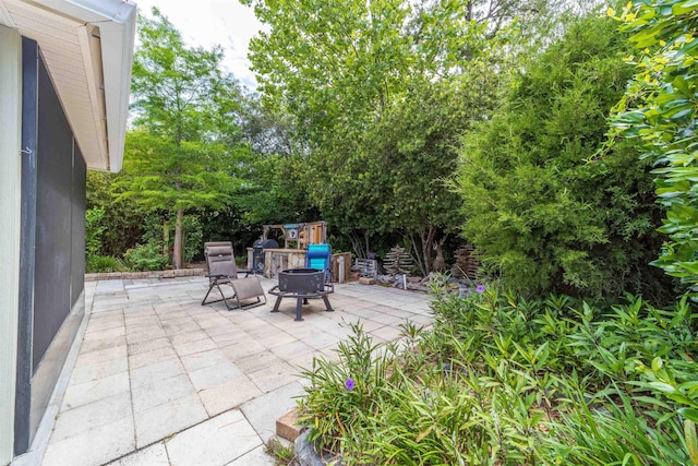 142 Patriot Ln, Elkton, FL 32033 - view of patio with a fire pit