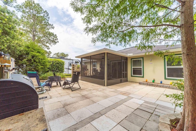 142 Patriot Ln, Elkton, FL 32033 - view of patio featuring a sunroom and area for grilling