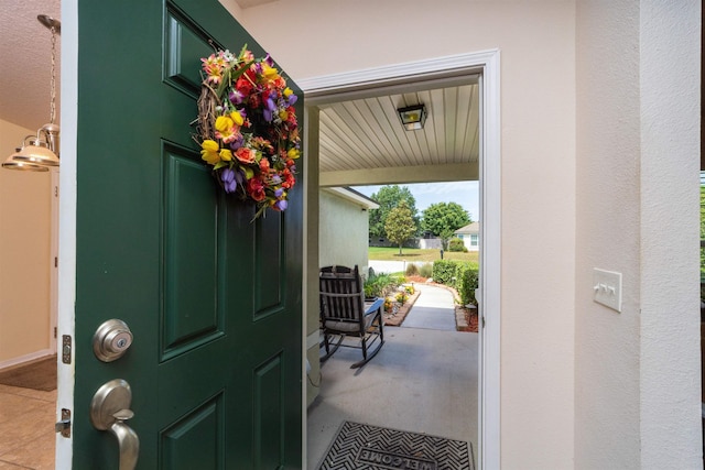 142 Patriot Ln, Elkton, FL 32033 - doorway to outside with light tile patterned flooring