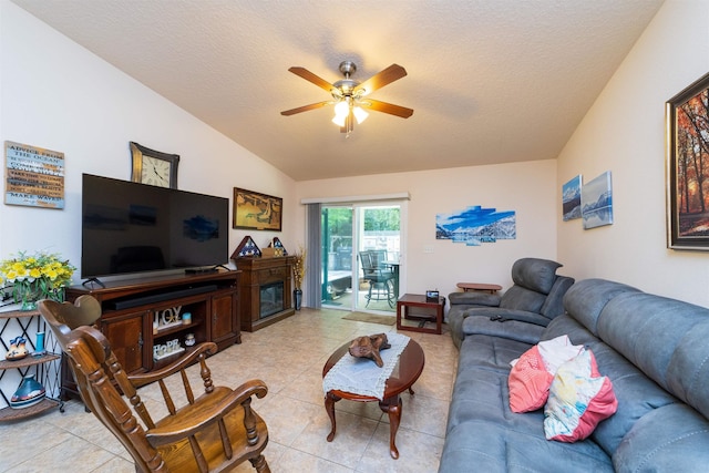 142 Patriot Ln, Elkton, FL 32033 - living room with a ceiling fan, light tile patterned floors, a textured ceiling, and vaulted ceiling
