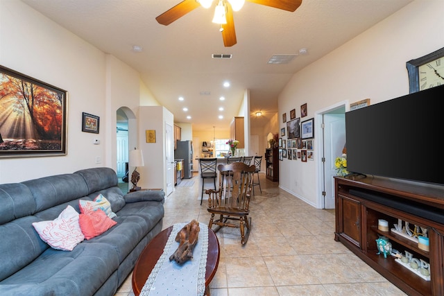 142 Patriot Ln, Elkton, FL 32033 - living room with arched walkways, ceiling fan, lofted ceiling, light tile patterned floors, and recessed lighting