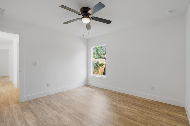 empty room featuring ceiling fan and light wood-type flooring