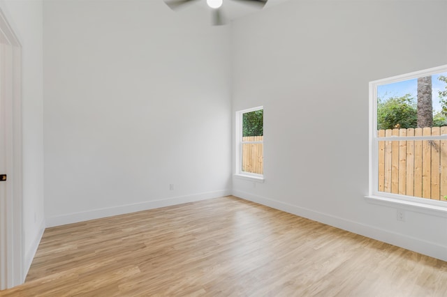 empty room featuring ceiling fan and light hardwood / wood-style floors