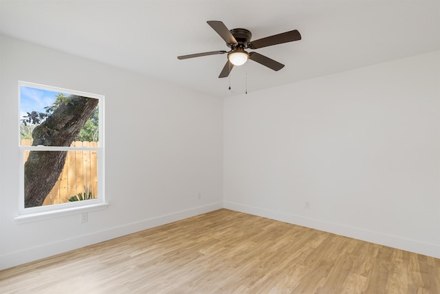 empty room featuring ceiling fan and light hardwood / wood-style flooring