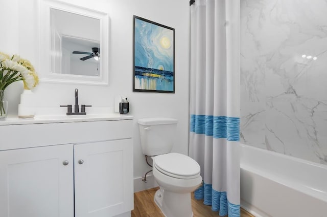 full bathroom featuring shower / bath combination with curtain, vanity, ceiling fan, hardwood / wood-style floors, and toilet