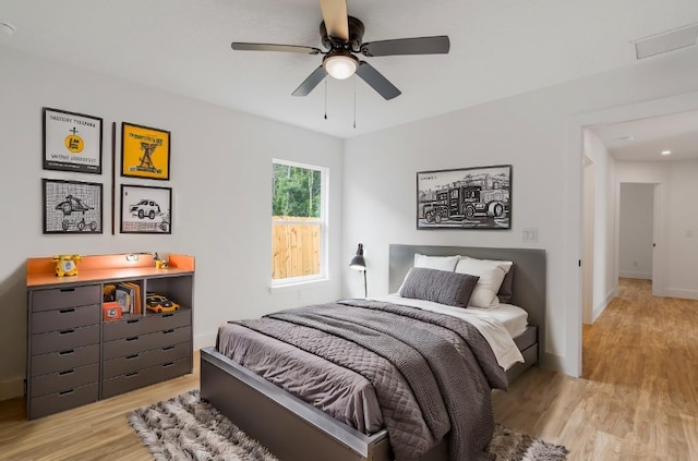 bedroom with light hardwood / wood-style flooring and ceiling fan