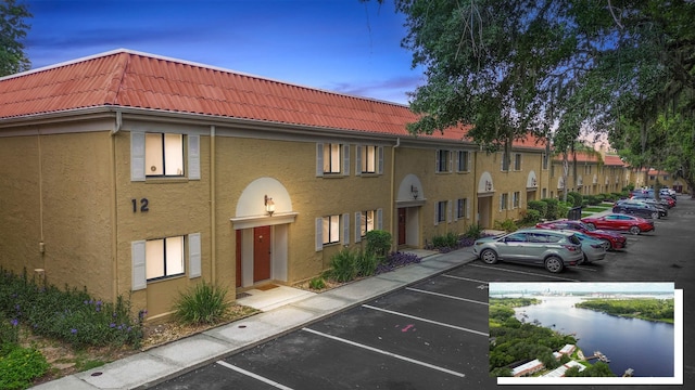 5811 Atlantic Blvd Unit 57, Jacksonville, FL 32207 - property at dusk with uncovered parking