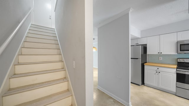 5811 Atlantic Blvd Unit 57, Jacksonville, FL 32207 - stairs featuring concrete flooring and baseboards