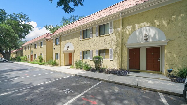 5811 Atlantic Blvd Unit 57, Jacksonville, FL 32207 - view of property with uncovered parking