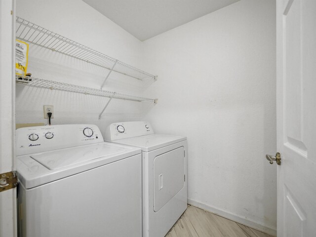 2200 Vista Cove Rd, Saint Augustine, FL 32084 - washroom featuring baseboards, separate washer and dryer, laundry area, and light wood-style flooring