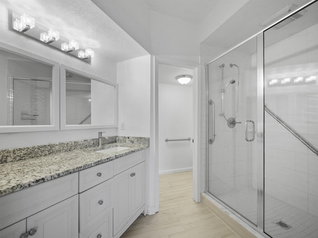2200 Vista Cove Rd, Saint Augustine, FL 32084 - bathroom with a shower stall, an inviting chandelier, and vanity