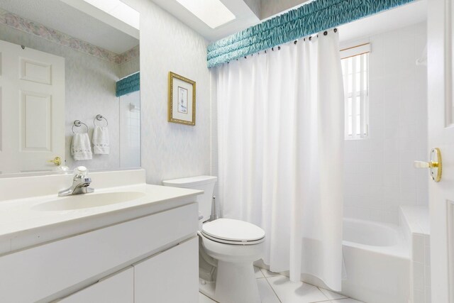 19 San Rafael Ct, Palm Coast, FL 32137 - bathroom with toilet, vanity, tile patterned floors, and shower / bath combo with shower curtain