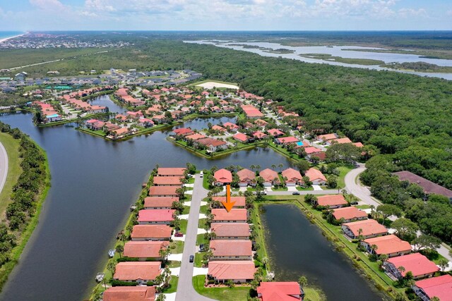19 San Rafael Ct, Palm Coast, FL 32137 - aerial perspective of suburban area with a nearby body of water and a heavily wooded area