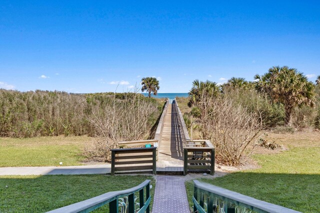19 San Rafael Ct, Palm Coast, FL 32137 - view of home's community with a lawn and a water view