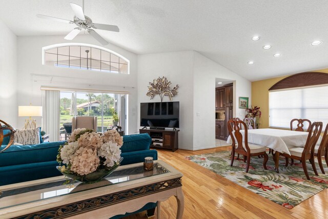 19 San Rafael Ct, Palm Coast, FL 32137 - living room featuring vaulted ceiling, light wood finished floors, recessed lighting, a ceiling fan, and a textured ceiling