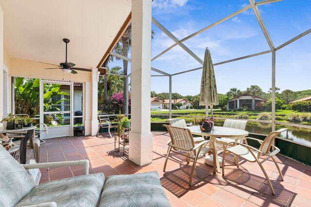 19 San Rafael Ct, Palm Coast, FL 32137 - view of patio featuring a ceiling fan, outdoor dining space, a lanai, and a water view