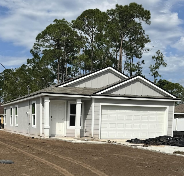 53 Point Of Woods Dr, Palm Coast, FL 32164 - view of front facade featuring a garage