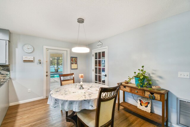 dining area featuring hardwood / wood-style floors