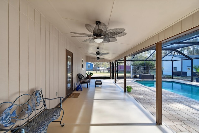 view of patio / terrace featuring a lanai and ceiling fan