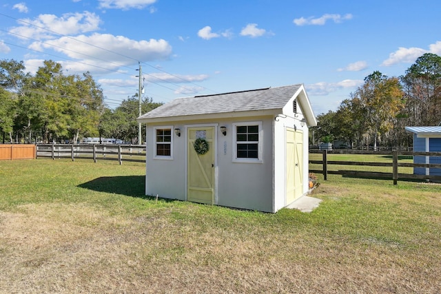 view of outbuilding with a lawn