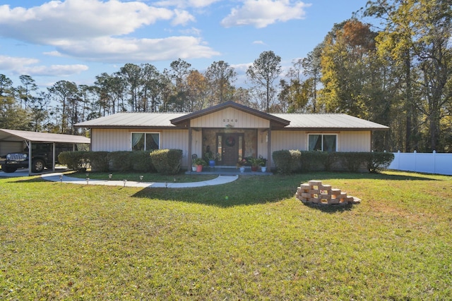 single story home with a front lawn and a carport