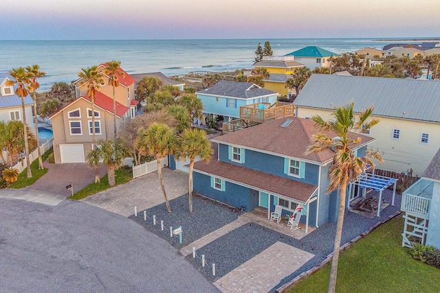 aerial view featuring a water view and a residential view