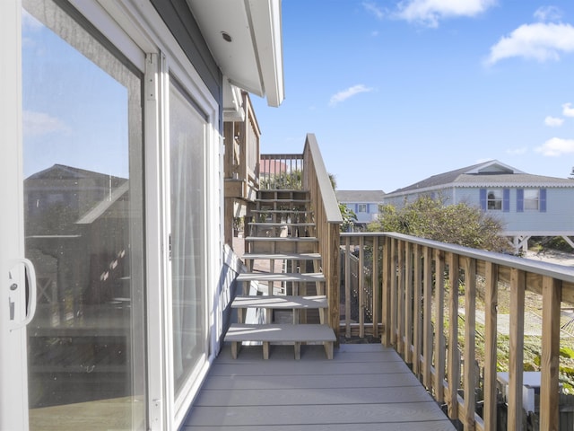 balcony featuring stairs