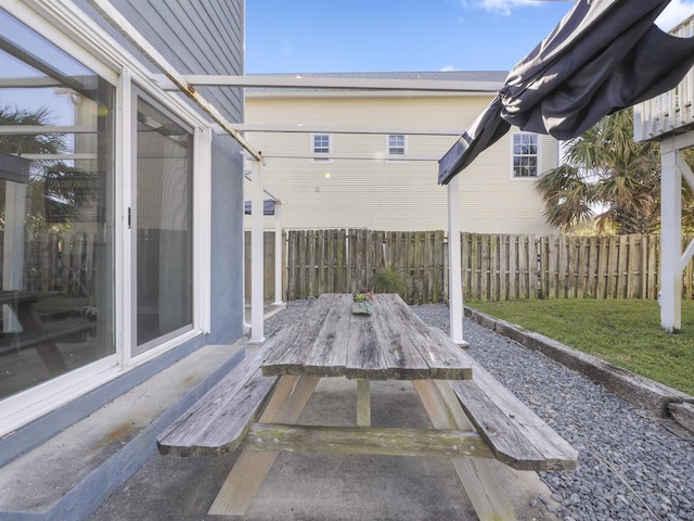 exterior space featuring fence and a wooden deck