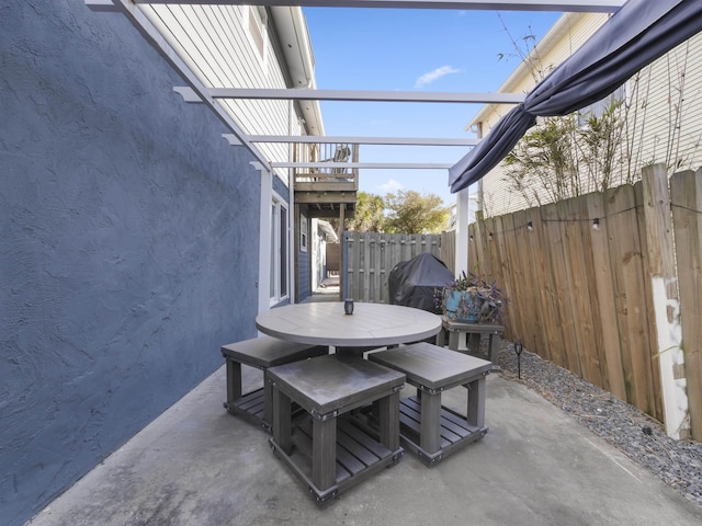 view of patio / terrace with fence and outdoor dining area