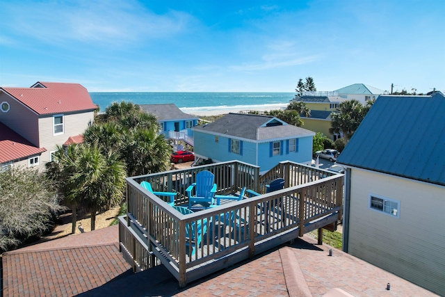 exterior space with a beach view and a water view