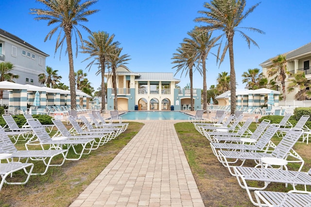 view of community featuring a pool and a patio area