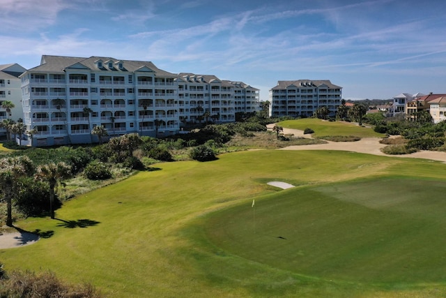 view of property's community featuring a lawn