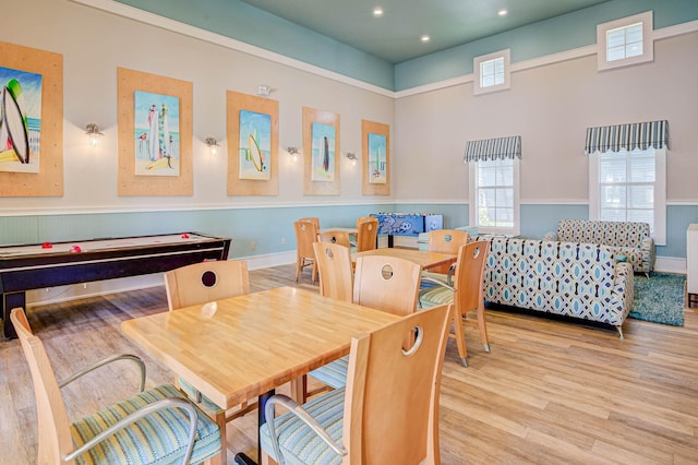 recreation room featuring light hardwood / wood-style floors and a healthy amount of sunlight