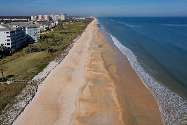 bird's eye view with a beach view and a water view