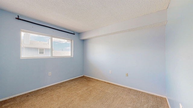 7175 A1A S # F238 # F238, Saint Augustine, FL 32080 - unfurnished room featuring carpet floors, a textured ceiling, and baseboards
