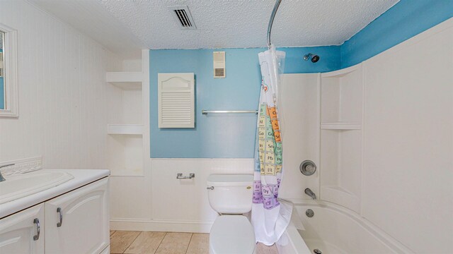 7175 A1A S # F238 # F238, Saint Augustine, FL 32080 - bathroom featuring a textured ceiling, shower / bath combination with curtain, toilet, and vanity