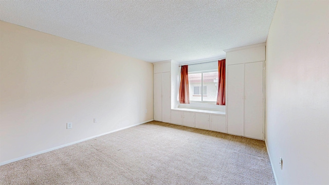 7175 A1A S # F238 # F238, Saint Augustine, FL 32080 - carpeted spare room featuring a textured ceiling and baseboards