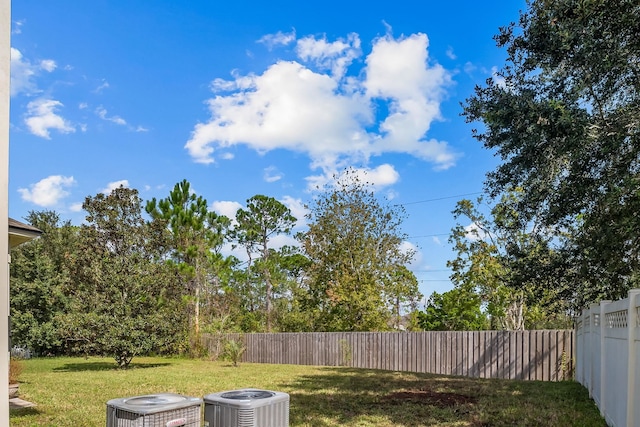 view of yard with central AC