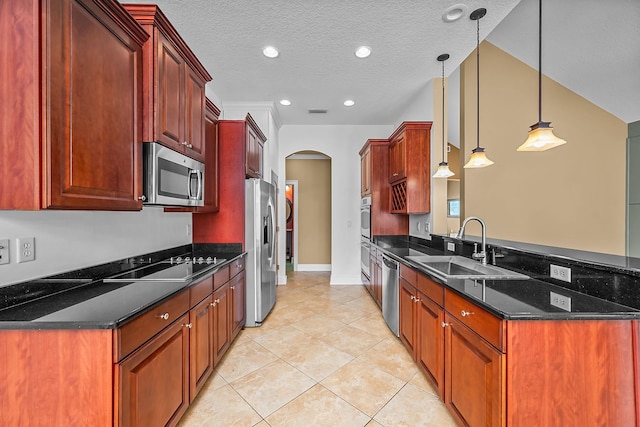 kitchen featuring pendant lighting, sink, a textured ceiling, appliances with stainless steel finishes, and light tile patterned flooring