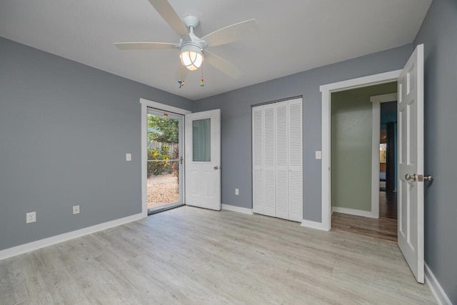 unfurnished bedroom featuring ceiling fan, light hardwood / wood-style floors, access to exterior, and a closet