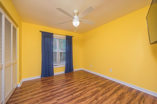 unfurnished bedroom featuring wood-type flooring, a closet, and ceiling fan