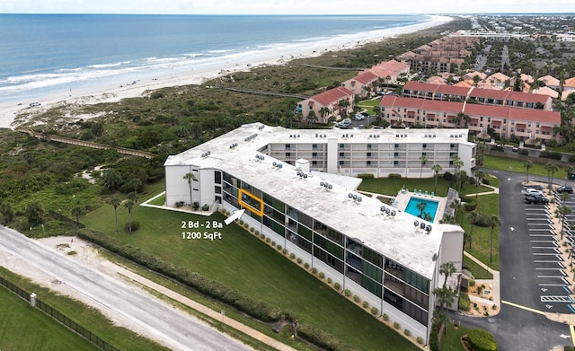 aerial view featuring a water view and a beach view