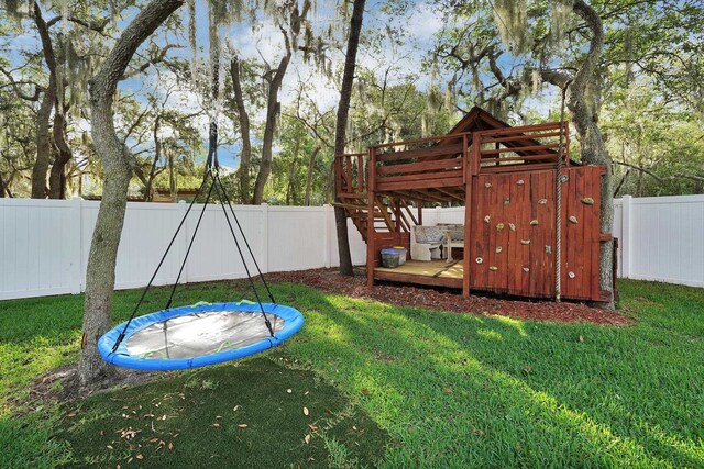 545 Sebastian Sq, Saint Augustine, FL 32095 - view of play area featuring a trampoline and a wooden deck