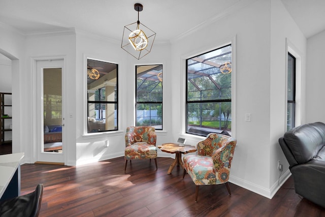 545 Sebastian Sq, Saint Augustine, FL 32095 - sitting room featuring wood finished floors, baseboards, crown molding, a chandelier, and arched walkways