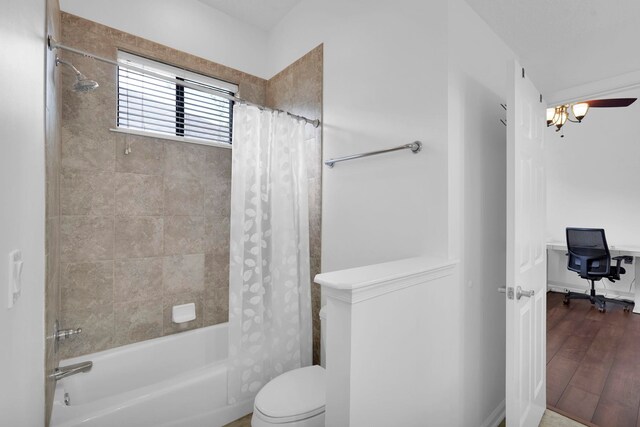 545 Sebastian Sq, Saint Augustine, FL 32095 - bathroom featuring shower / bath combo with shower curtain, toilet, and wood finished floors
